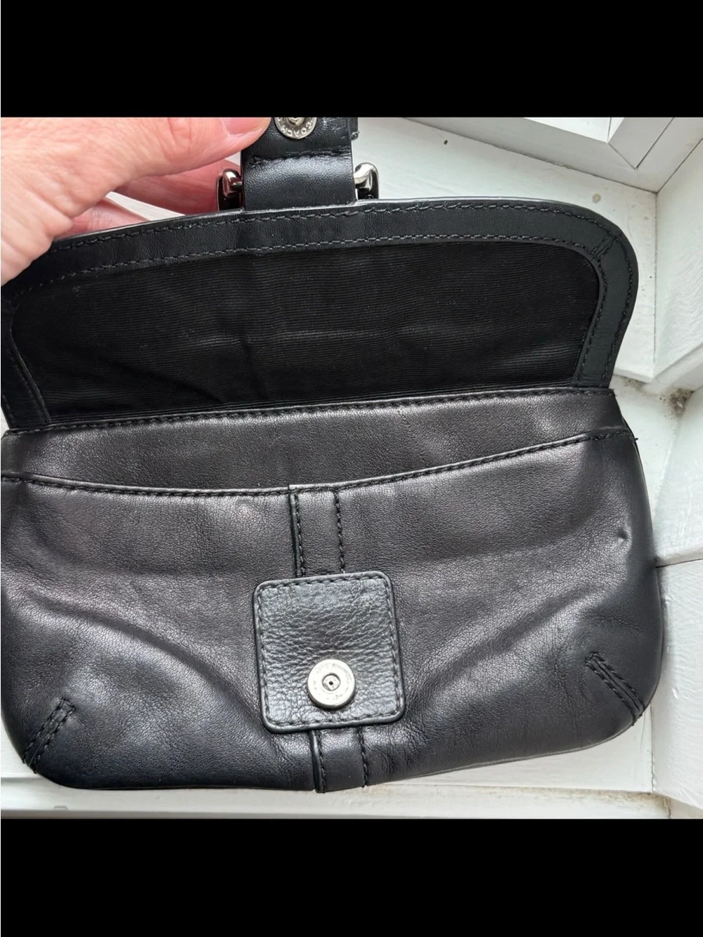Coach, Soho, wristlet Black Leather Wristlet with Buckle Detail excellent condi